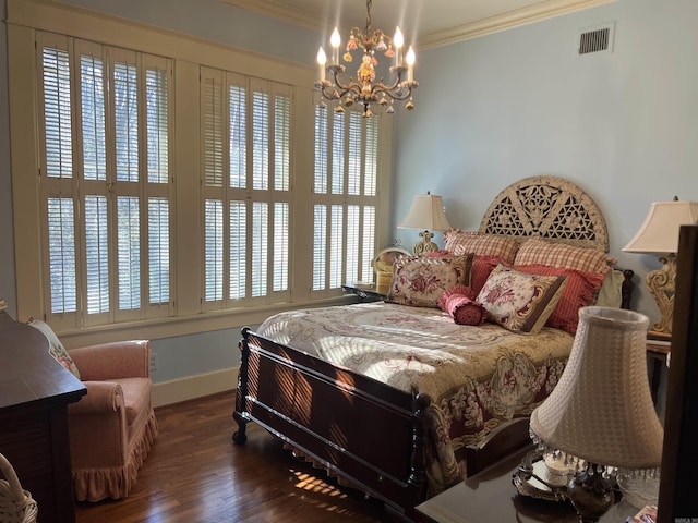 bedroom featuring dark wood-type flooring, an inviting chandelier, and crown molding