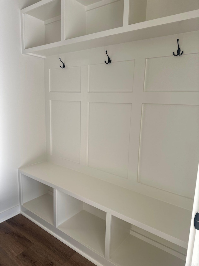 mudroom with baseboards and dark wood finished floors