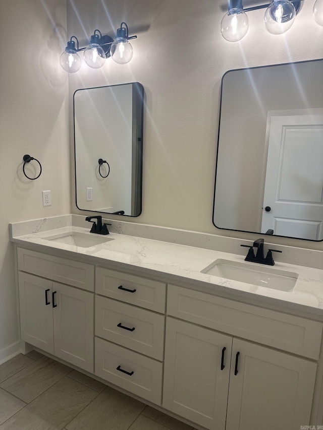 bathroom featuring double vanity and a sink