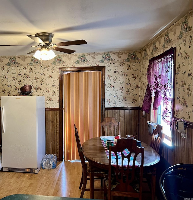 dining area featuring ceiling fan and hardwood / wood-style floors