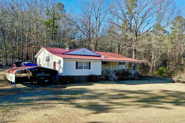 view of front of home with covered porch and a front yard