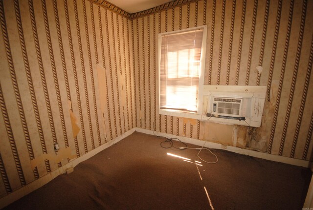 interior space featuring carpet and cooling unit