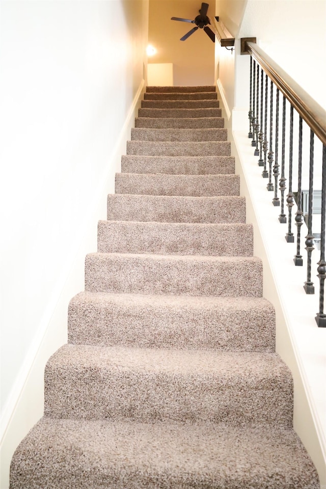 stairs with ceiling fan