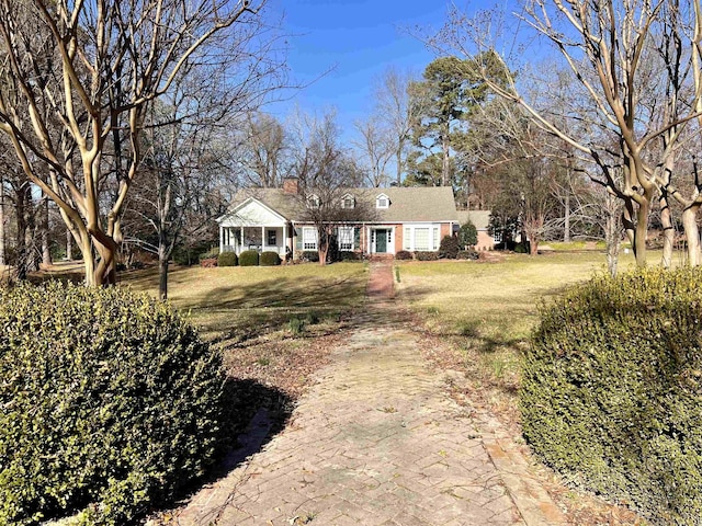 single story home featuring a front yard