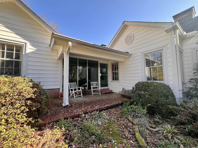 back of property featuring a porch