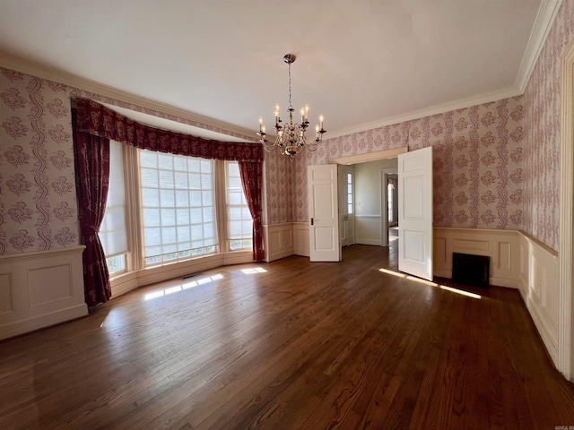 interior space with ornamental molding, dark hardwood / wood-style flooring, and a notable chandelier