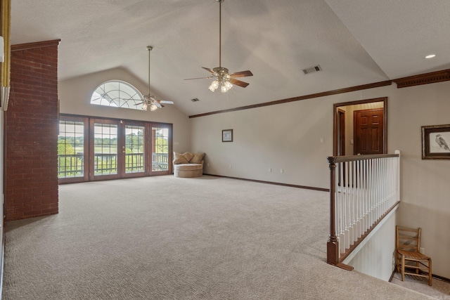 unfurnished living room with carpet, ceiling fan, and vaulted ceiling