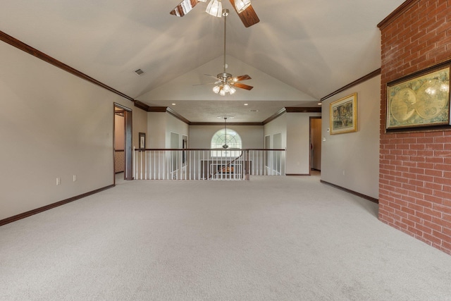 carpeted empty room with lofted ceiling, crown molding, and ceiling fan with notable chandelier