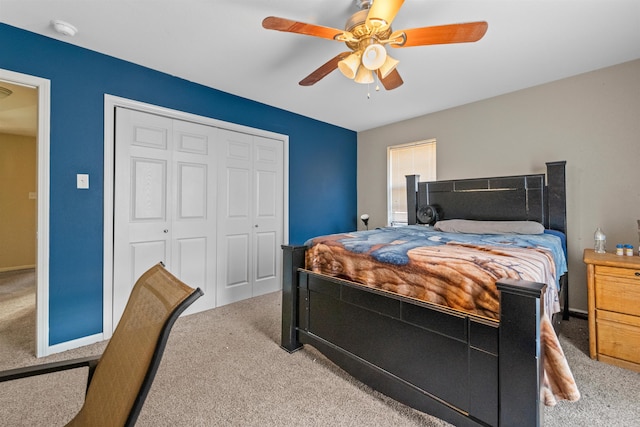 bedroom featuring carpet flooring, ceiling fan, and a closet