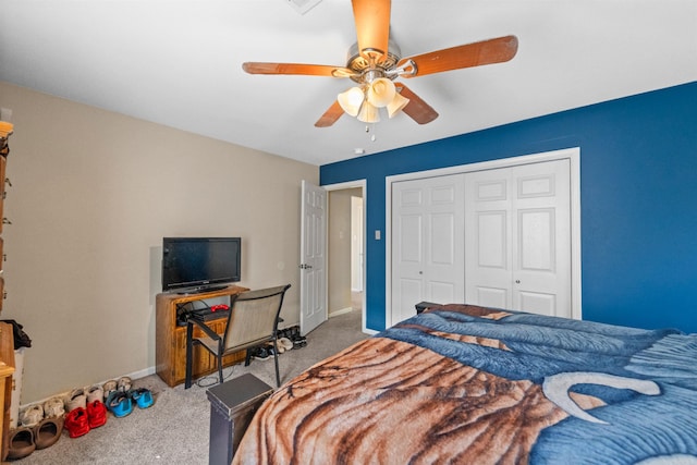 bedroom featuring carpet, a closet, and ceiling fan