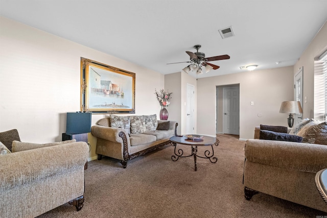 carpeted living room with ceiling fan