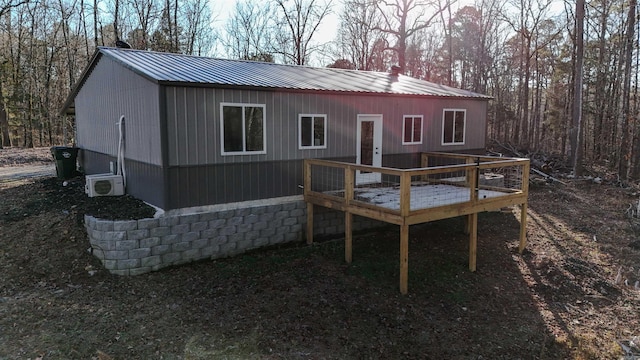 back of house with a wooden deck