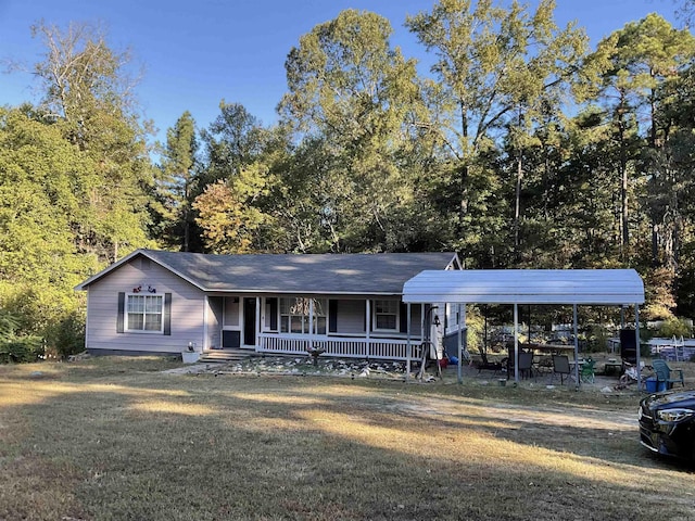 single story home featuring covered porch, a front yard, and a carport