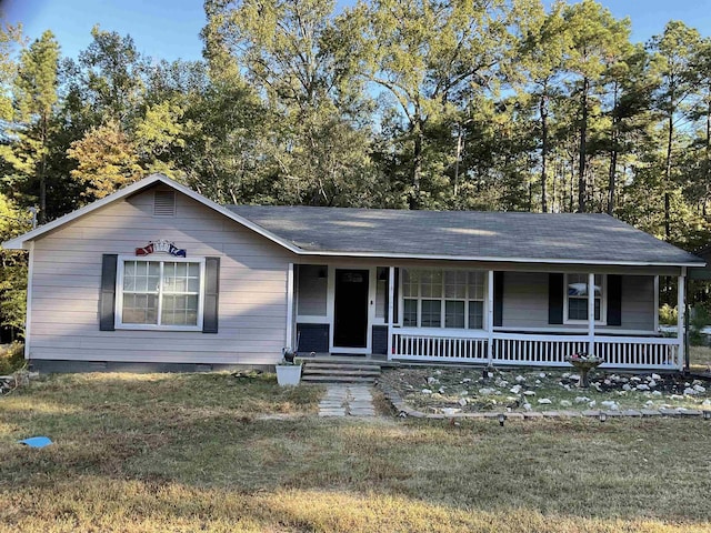 ranch-style home with covered porch and a front lawn