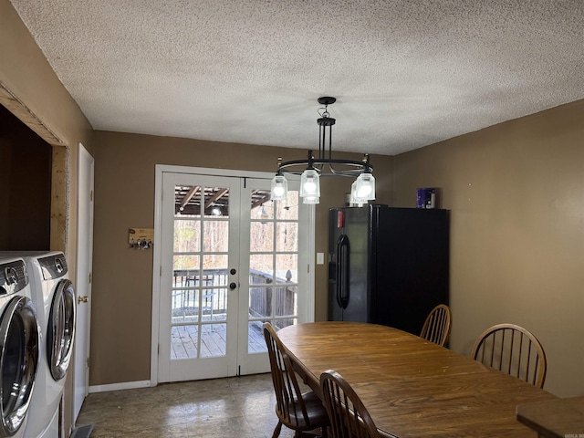 dining room featuring washing machine and clothes dryer, french doors, and a textured ceiling