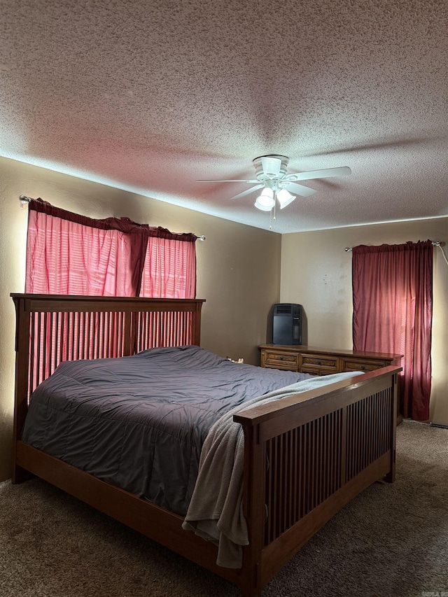 bedroom with carpet flooring, ceiling fan, and a textured ceiling