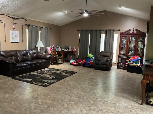 living room with ceiling fan and vaulted ceiling