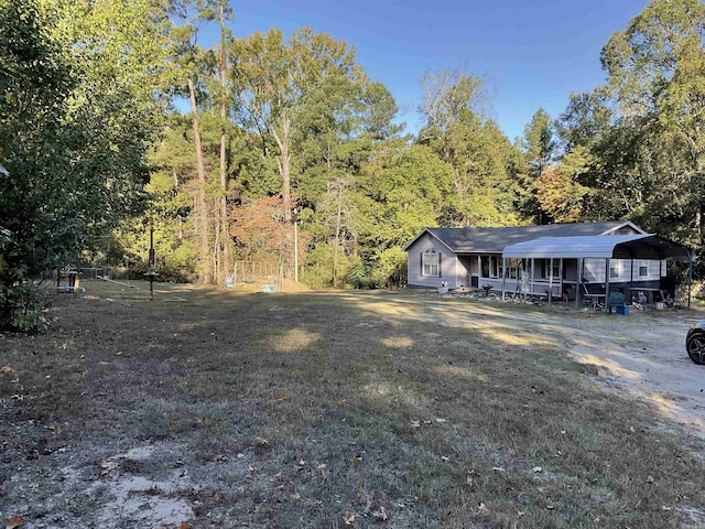 view of yard featuring a carport