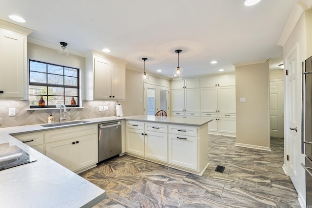 kitchen with sink, stainless steel dishwasher, kitchen peninsula, pendant lighting, and decorative backsplash