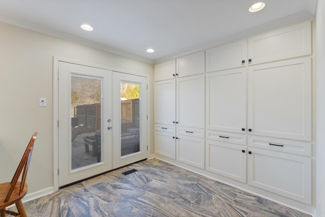 doorway to outside with french doors and ornamental molding