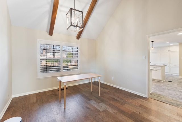 home office featuring a chandelier, lofted ceiling with beams, and wood-type flooring