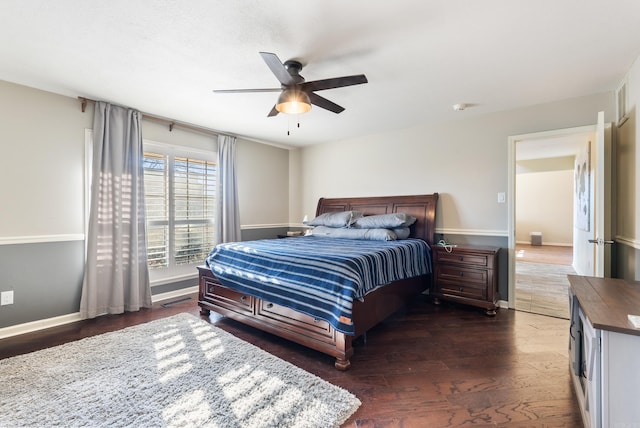 bedroom with ceiling fan and dark hardwood / wood-style flooring