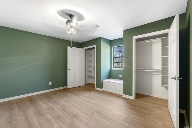 unfurnished bedroom featuring ceiling fan and light wood-type flooring