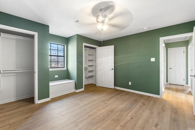 unfurnished bedroom with light hardwood / wood-style flooring and ceiling fan