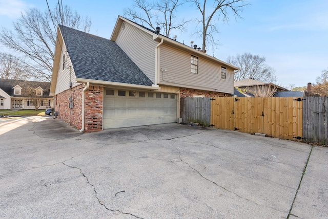 view of side of property with a garage