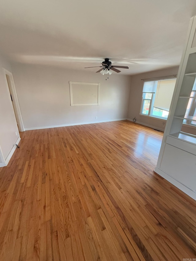 interior space with ceiling fan and light hardwood / wood-style floors