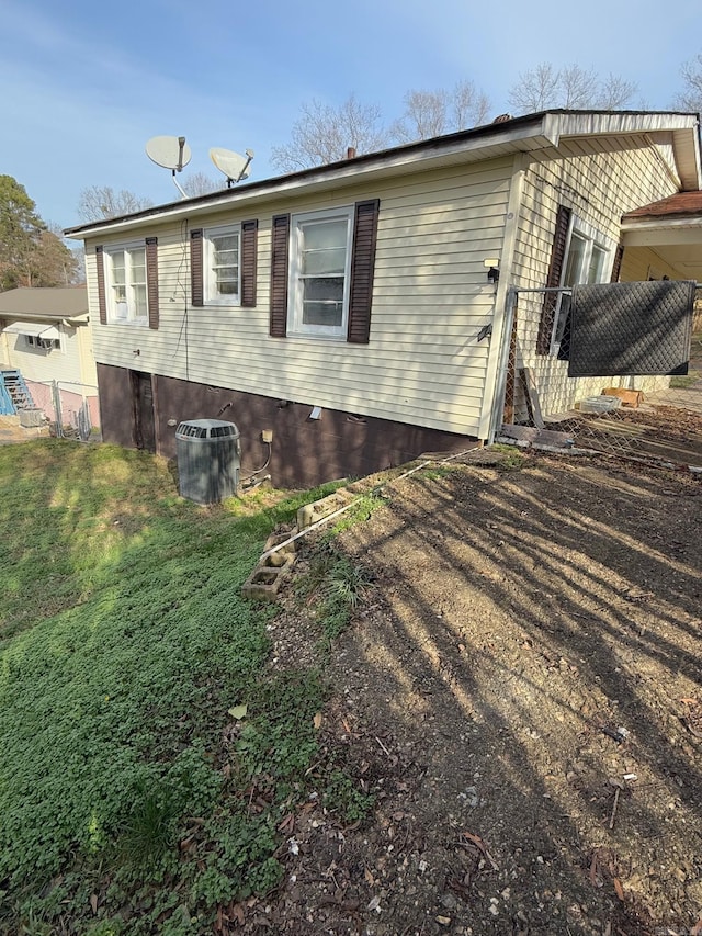 view of side of property featuring central AC unit