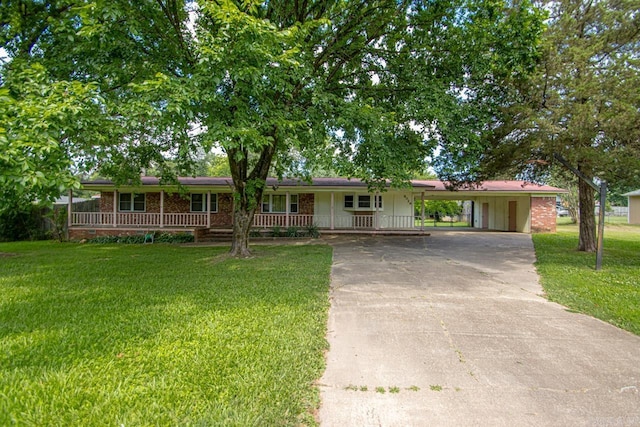 ranch-style home with a carport, covered porch, and a front yard