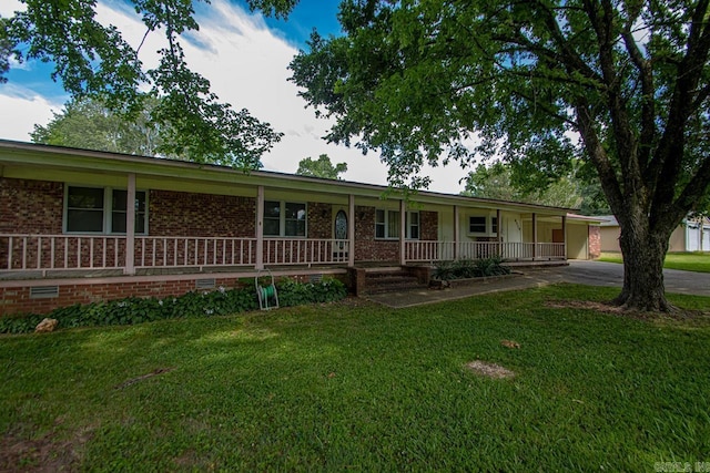 ranch-style home with a porch and a front yard