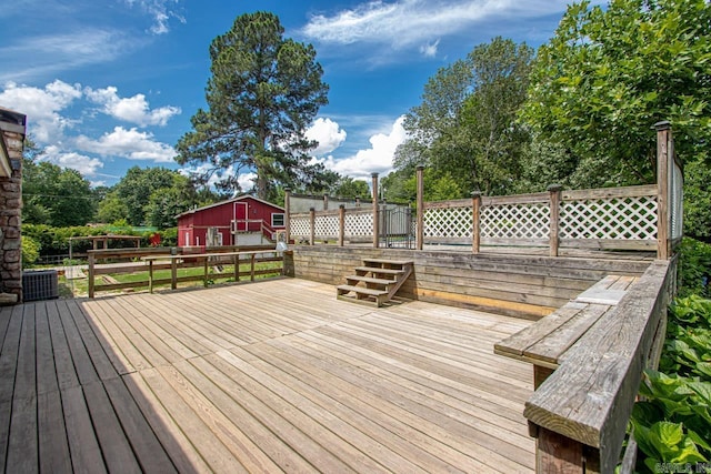 wooden terrace with an outbuilding