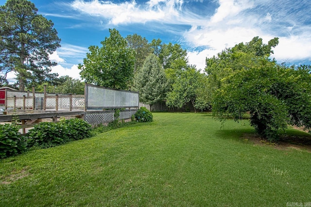 view of yard with a wooden deck