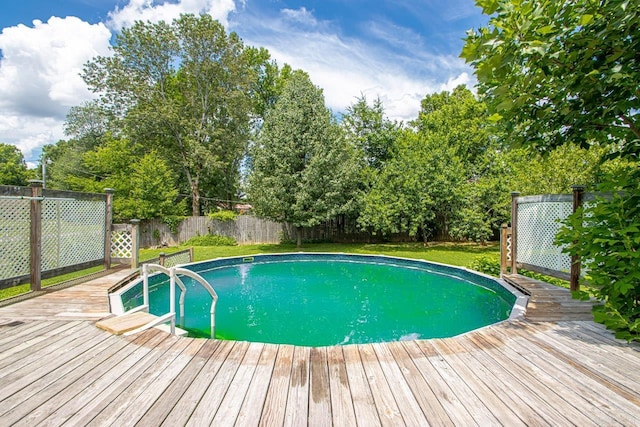 view of pool featuring a wooden deck