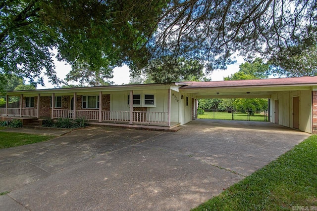 single story home featuring a porch and a carport