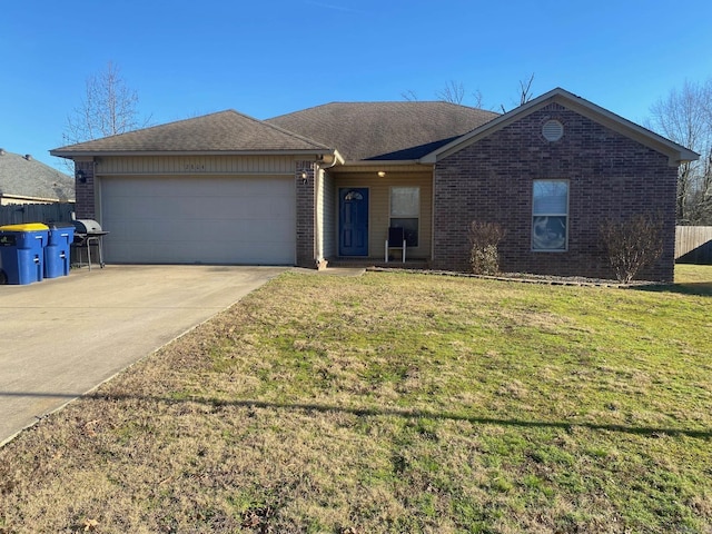 ranch-style home featuring a garage, brick siding, fence, driveway, and a front lawn