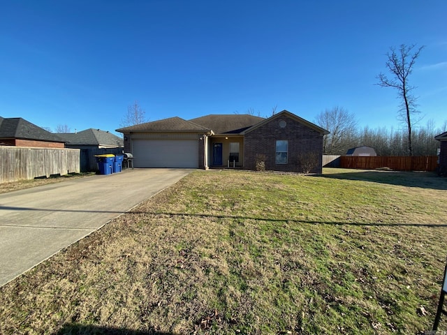 single story home with a garage and a front lawn