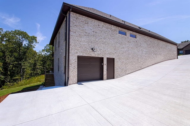 view of property exterior featuring a garage