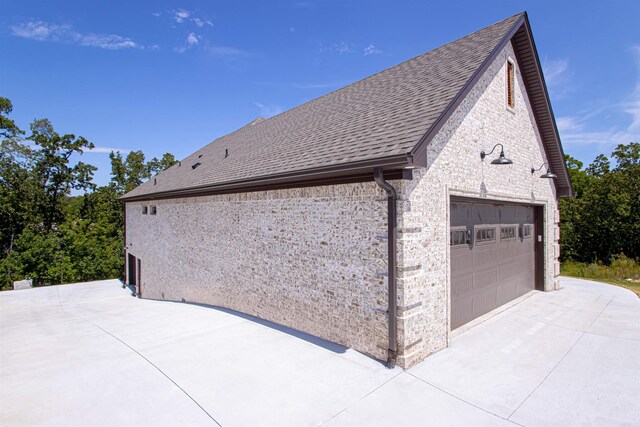 view of side of property featuring a garage