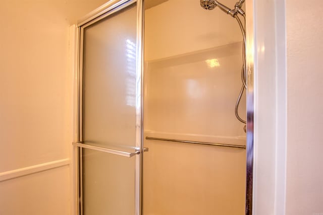 room details featuring a shower with door