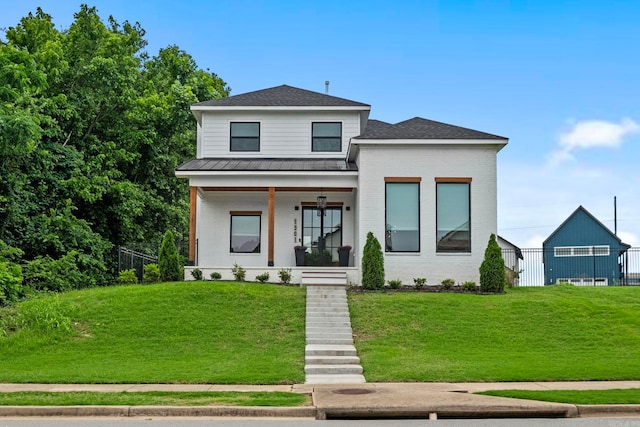 view of front of property featuring a porch and a front lawn