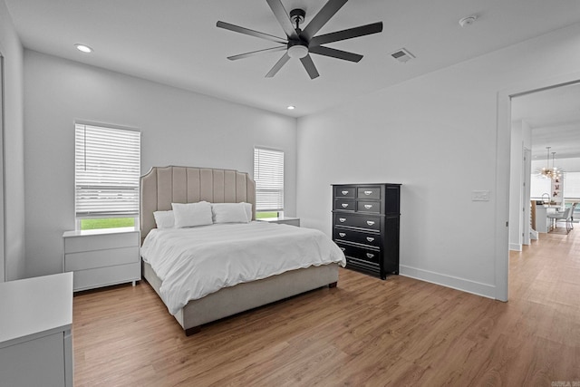 bedroom featuring ceiling fan and wood-type flooring