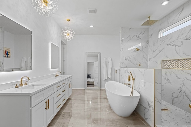 bathroom featuring vanity, shower with separate bathtub, and an inviting chandelier