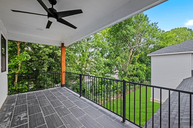 view of patio / terrace with ceiling fan and a balcony