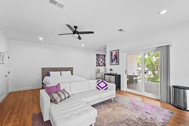 bedroom with ceiling fan, wood-type flooring, and access to outside