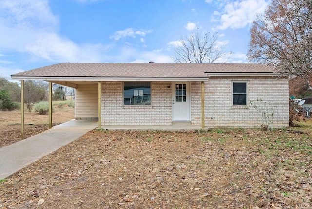 ranch-style home featuring a carport