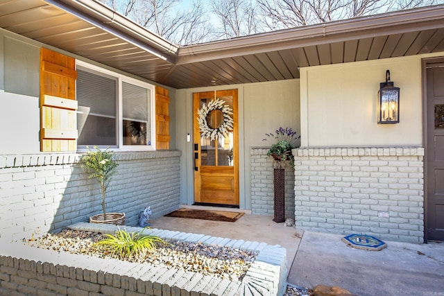 doorway to property featuring covered porch