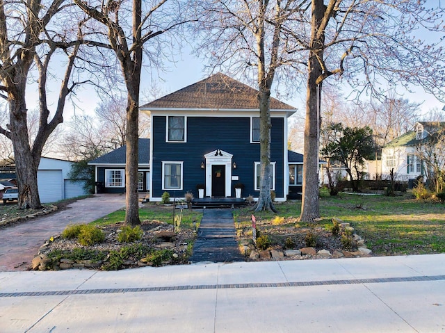 view of front of home featuring an outbuilding and a garage